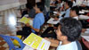 The university students learning all about phonemic awareness and how to use the magnetic boards.