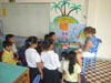 Showing the students the “lonely” vowels on the magnetic board.