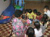 We donated crayons, scissors, and glue for the students. This lady helped to put the crayons in bags, while being watched by an audience of preschoolers.